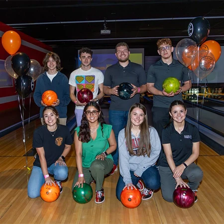 Klein Internship team photo indoors at bowling alley